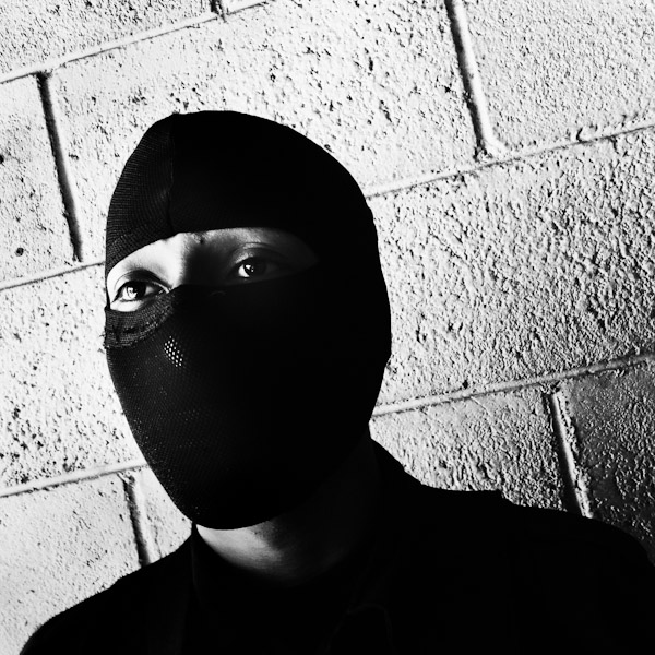 A member of the Police anti-gang unit, getting ready for an operation in the streets, stands on the base yard in San Salvador, El Salvador.