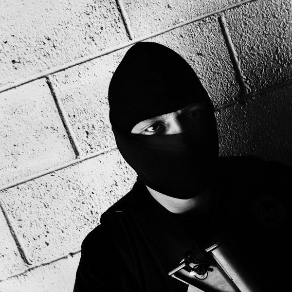 A member of the Police anti-gang unit, getting ready for an operation in the streets, stands on the base yard in San Salvador, El Salvador.