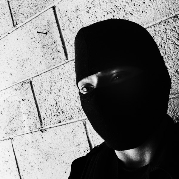 A member of the Police anti-gang unit, getting ready for an operation in the streets, stands on the base yard in San Salvador, El Salvador.