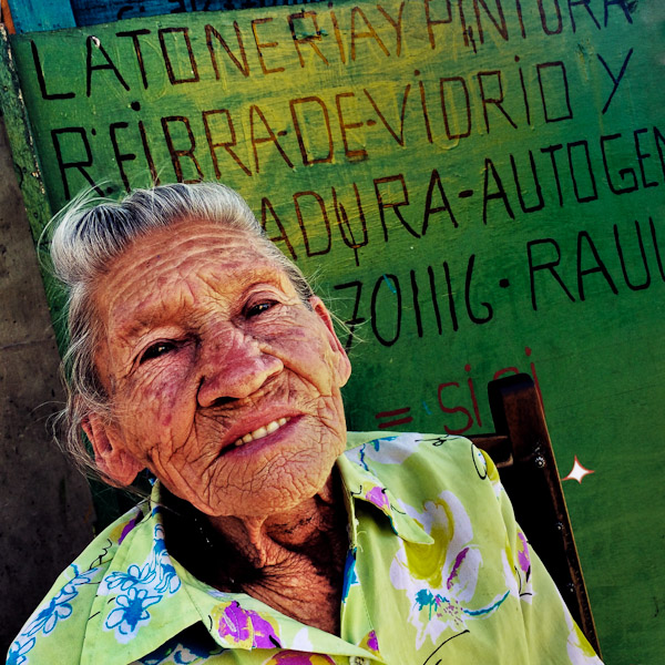Julia Rosa Cardoña, an 88-years-old Colombian woman, poses for a picture on the street of barrio Triste, a neighborhood in the center of Medellín, Colombia.