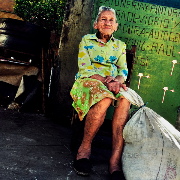 Julia Rosa Cardoña, an 88-years-old Colombian woman, poses for a picture on the street of barrio Triste, a neighborhood in the center of Medellín, Colombia