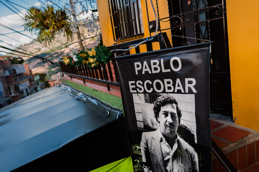 A banner, depicting the drug lord Pablo Escobar, is seen hung above a barber shop in the Pablo Escobar neighborhood, Medellín, Colombia.
