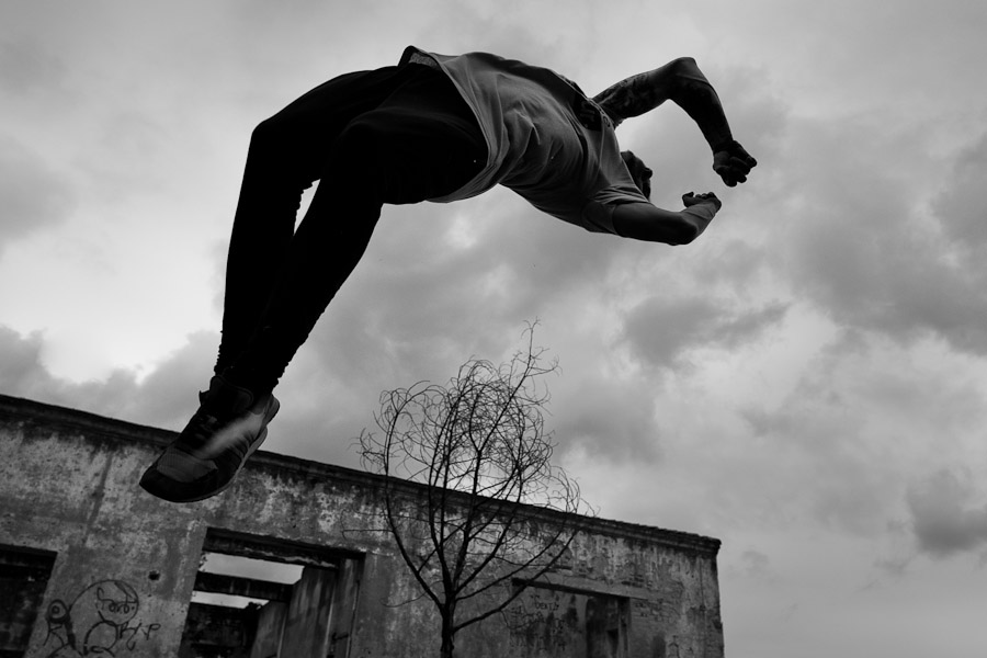 Jose Rodriguez, a parkour athlete from Plus Parkour team, does a back flip as he practices his acrobatics skills during a training exercise in Bogotá, Colombia.