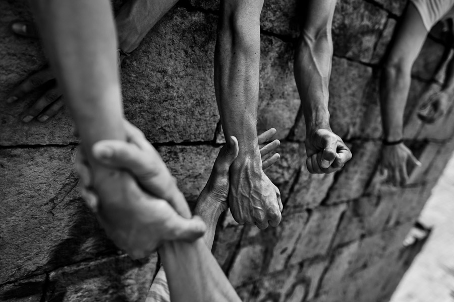 A Colombian parkour athlete, hung on his mates’ hands, climbs on the wall during a training session of Tamashikaze team in a park in Kennedy, Bogotá, Colombia.