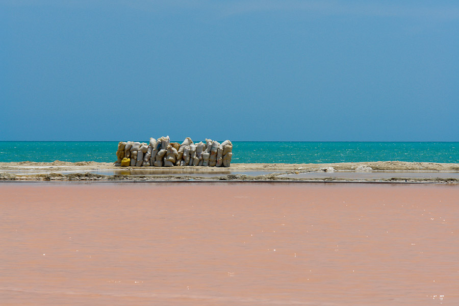 Sacks of salt aligned on the salt lagoon bank in Salinas de Manaure, Colombia, 12 May 2006.