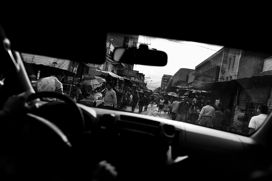 A street in the city center seen from the Police patrol vehicle in San Salvador, El Salvador.