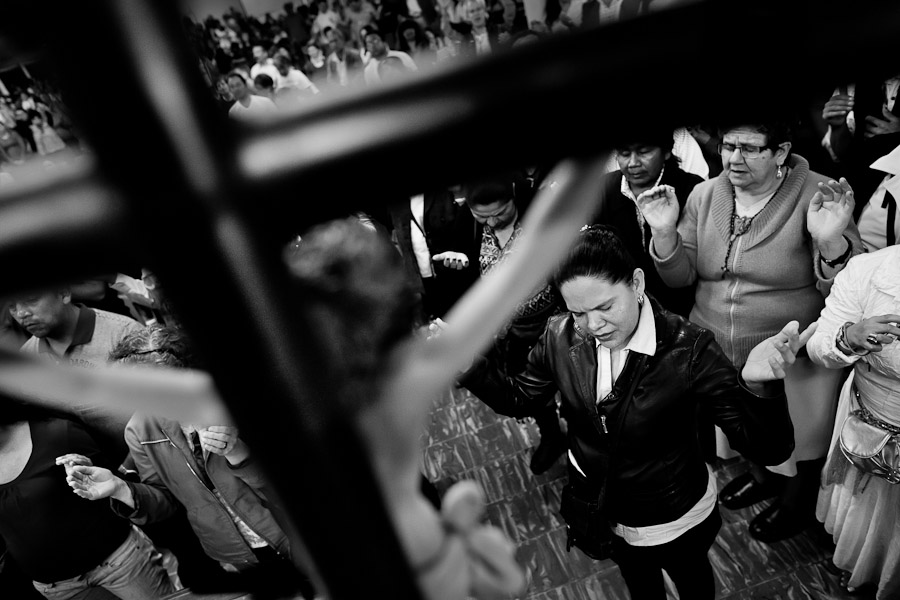 Colombian believers pray during the religious healing ritual performed by pastors of Misioneros Marianos church in Bogota, Colombia.