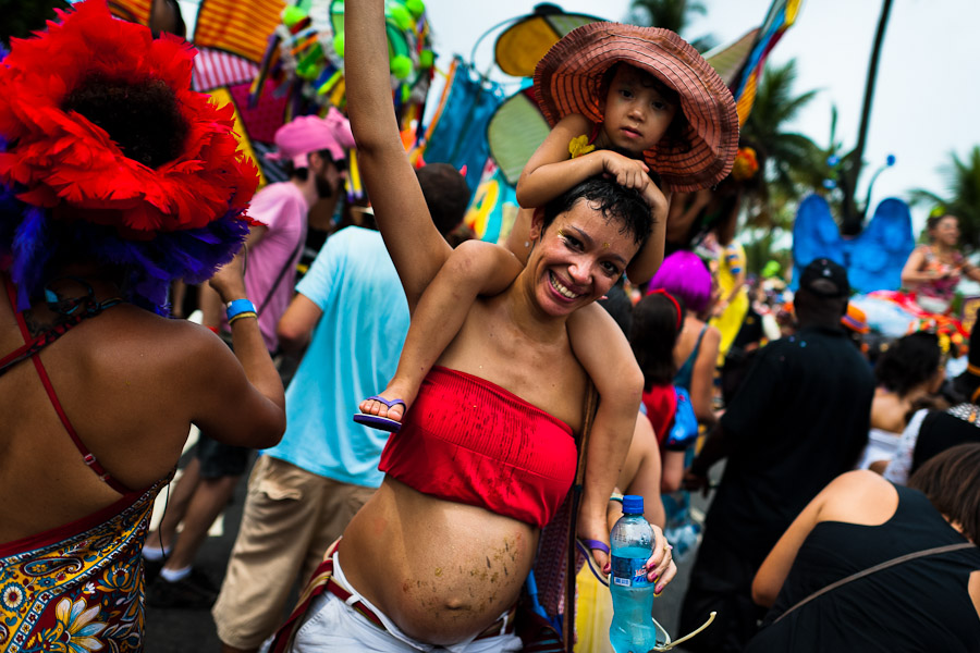 A pregnant woman dances during the Orquestra Voadora band performance in the carnival street party in Flamengo, Rio de Janeiro, Brazil.