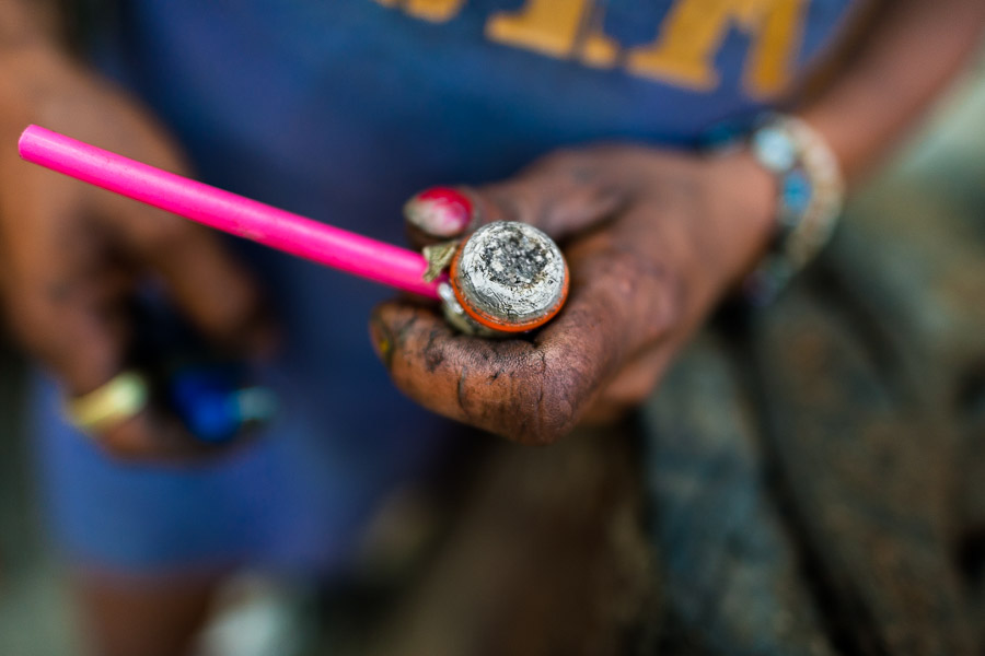 A hand of a Colombian drug user, holding a pipe loaded with ‘bazuco’ (a raw cocaine paste), is seen on the street of ‘Bronx’, in Medellín, Colombia.