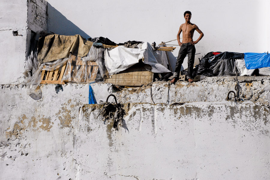 Moroccan young boys who intend to escape from Morocco live in shacks built around the port of Tanger.