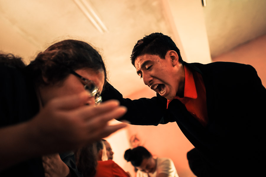 A Christian follower, a member of a local religious cult, screams during the religious exctasy in a home church in San Salvador, El Salvador.