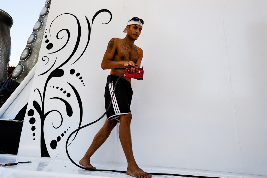 A samba school member works on a carnival float inside the workshop in Rio de Janeiro, Brazil.