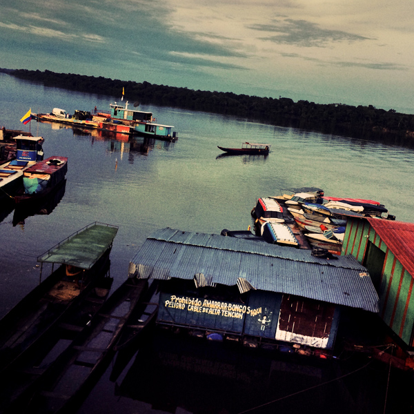 A Colombian farmer’s canoe arrives to the floating docks at the early morning sunrise in the river port of Inírida, Guainía, Colombia.