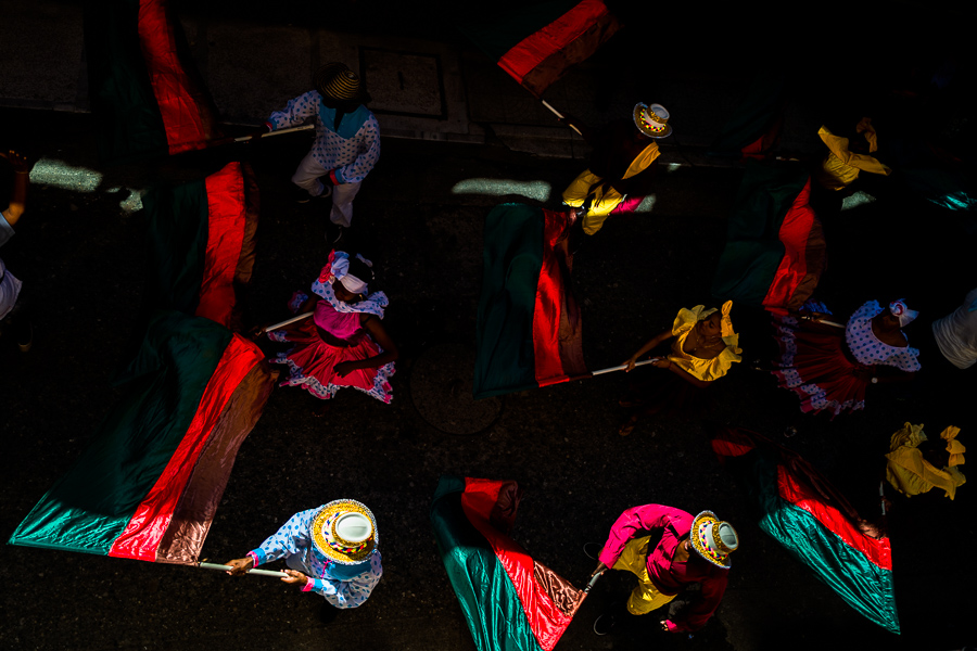 Afro-Colombian dancers of the Yescagrande neighborhood wave the flags during the San Pacho festival in Quibdó, Colombia.