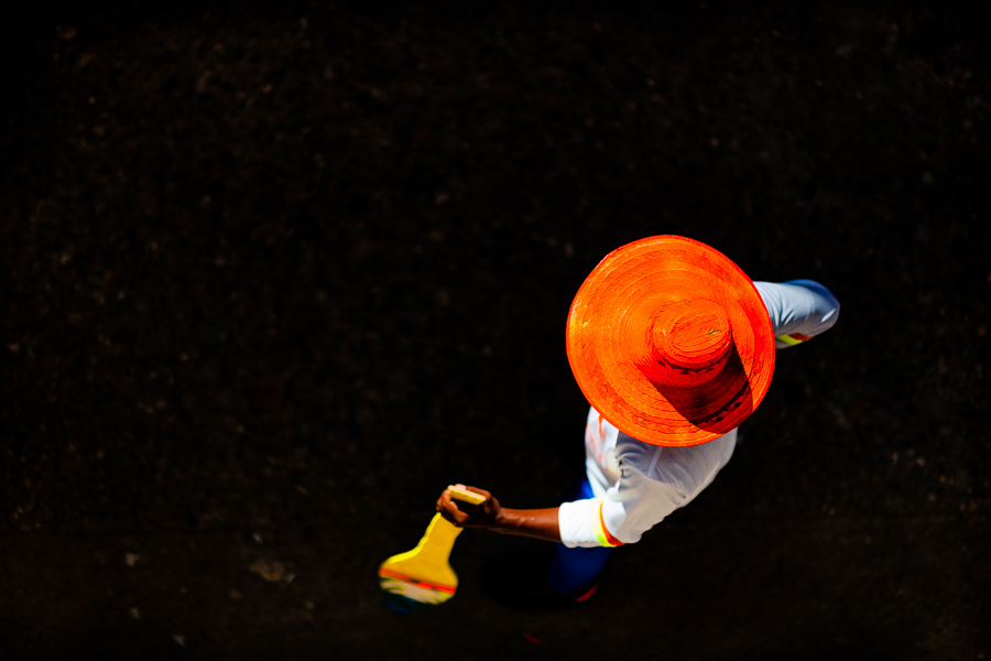 An Afro-Colombian dancer of the Yescagrande neighborhood performs with a wooden paddle during the San Pacho festival in Quibdó, Colombia.