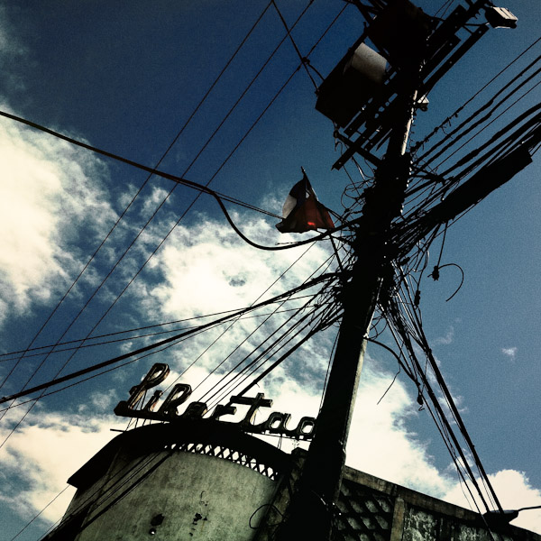 A vintage neon sign ‘Libertad’ (Freedom) seen on the roof of a building in the center of San Salvador, El Salvador.