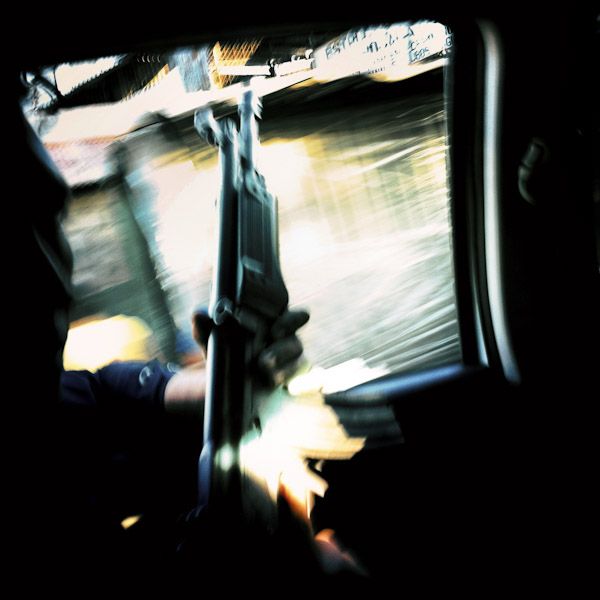 A Salvadorean policeman, a member of the special ‘Halcones’ unit, holds an assault rifle during his shift in San Salvador, El Salvador.