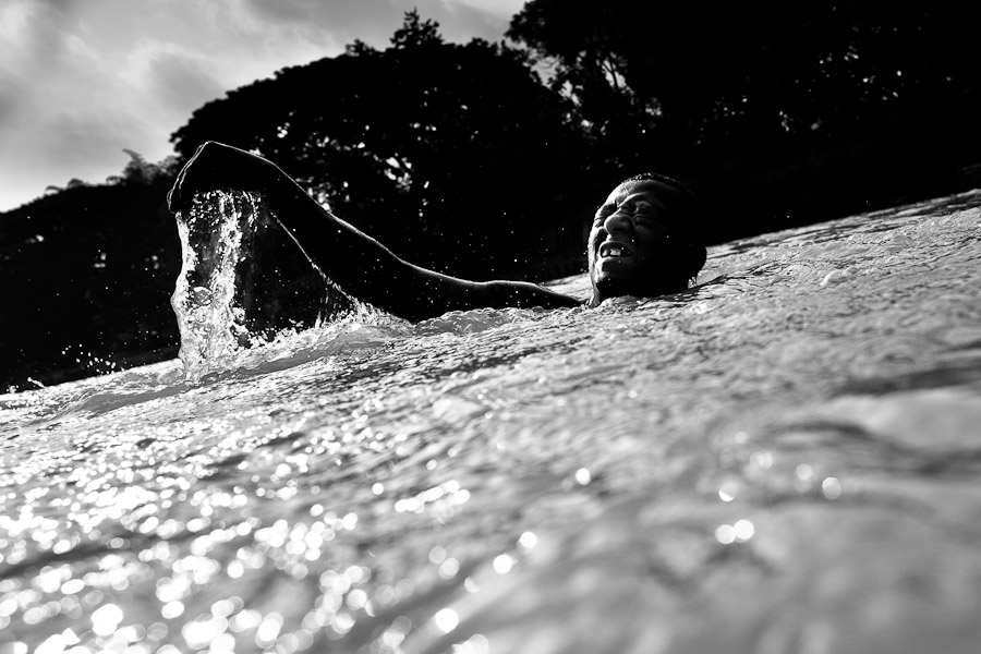 A sand miner dives under the water to extract sand from the bottom of the river La Vieja in Cartago, Colombia.