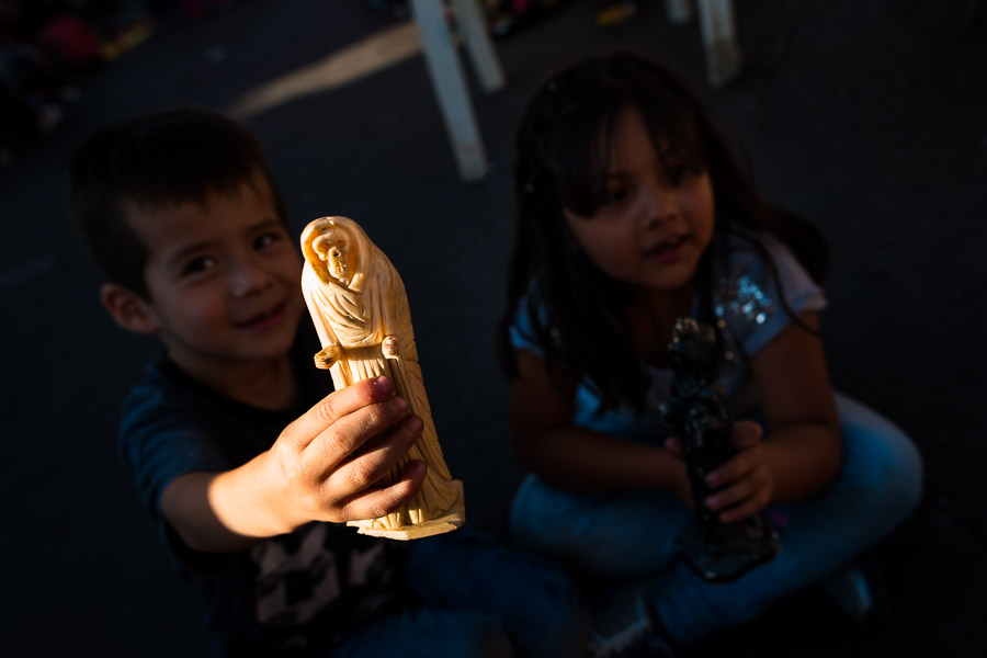 A Mexican boy shows a figurine of Santa Muerte (Holy Death) during a religious pilgrimage to Santa Muerte shrine in Tepito, Mexico City, Mexico.