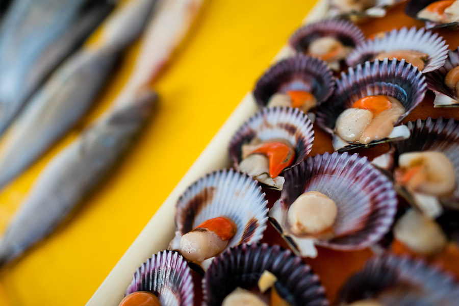 Fresh scallops and fish for sale seen at Chorrillos seafood and fish market in Lima, Peru.