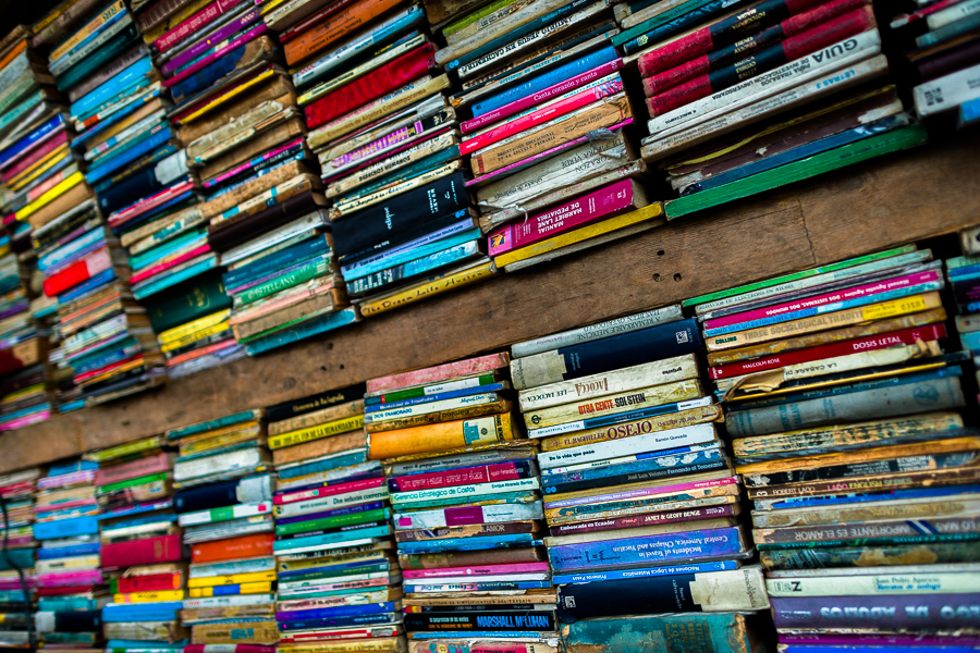 Spines of used books are seen stacked in a secondhand bookshop in San Salvador, El Salvador.