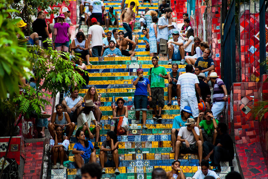 Mostly young foreign tourists relax, drink beer and smoke on Selaron's Stairs (Escadaria Selarón) in Rio de Janeiro.