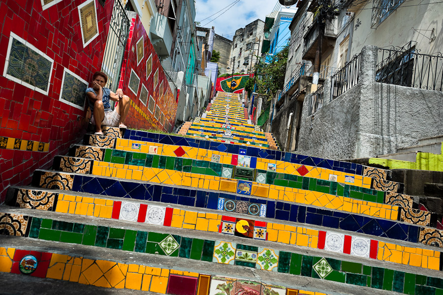 A woman sits on Selaron's Stairs between the neighborhoods of Santa Teresa and Lapa in Rio de Janeiro.