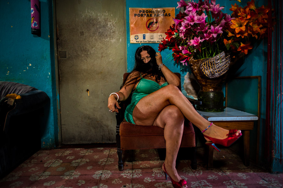 A Mexican sex worker poses for a picture while waiting for clients in a street sex bar in San Salvador, El Salvador.