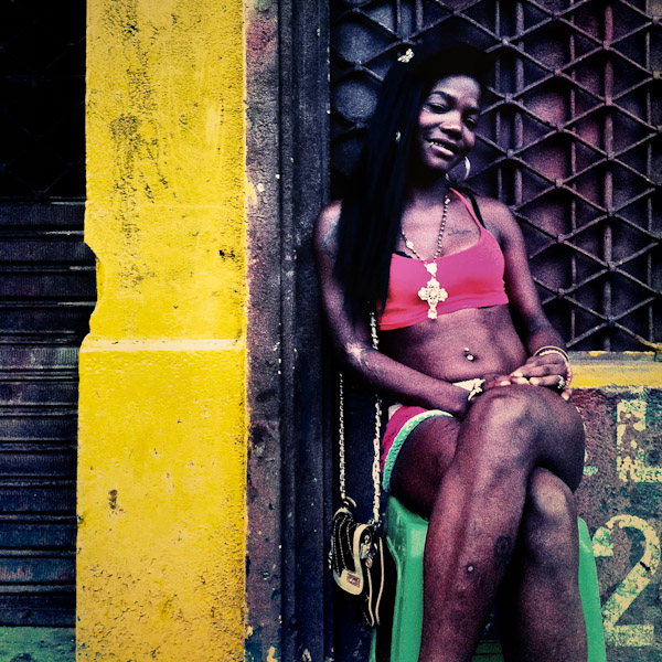 A Colombian sex worker waits for the clients on the street, in front of a room where she offers her services, Cali, Colombia.