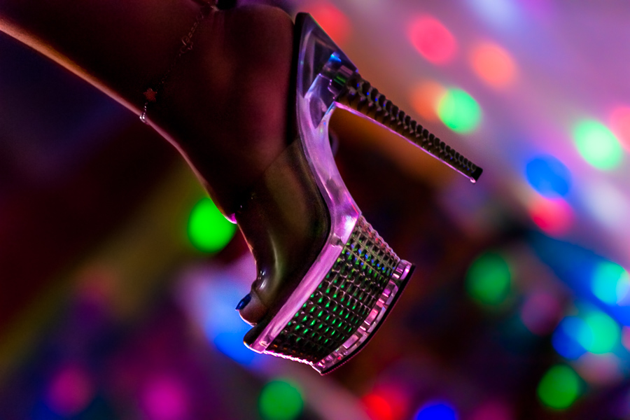 A Salvadoran sex worker’s foot in a high heel shoe is seen while waiting for customers in a sex club in San Salvador, El Salvador.