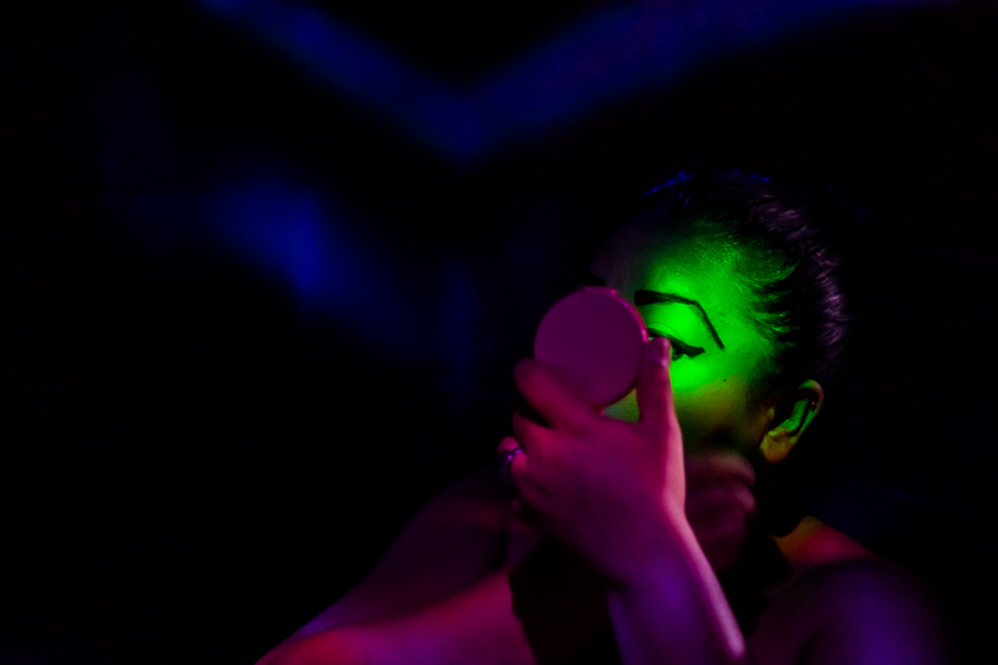 A Salvadoran sex worker applies makeup before the beginning of the work shift in a sex club in San Salvador, El Salvador.