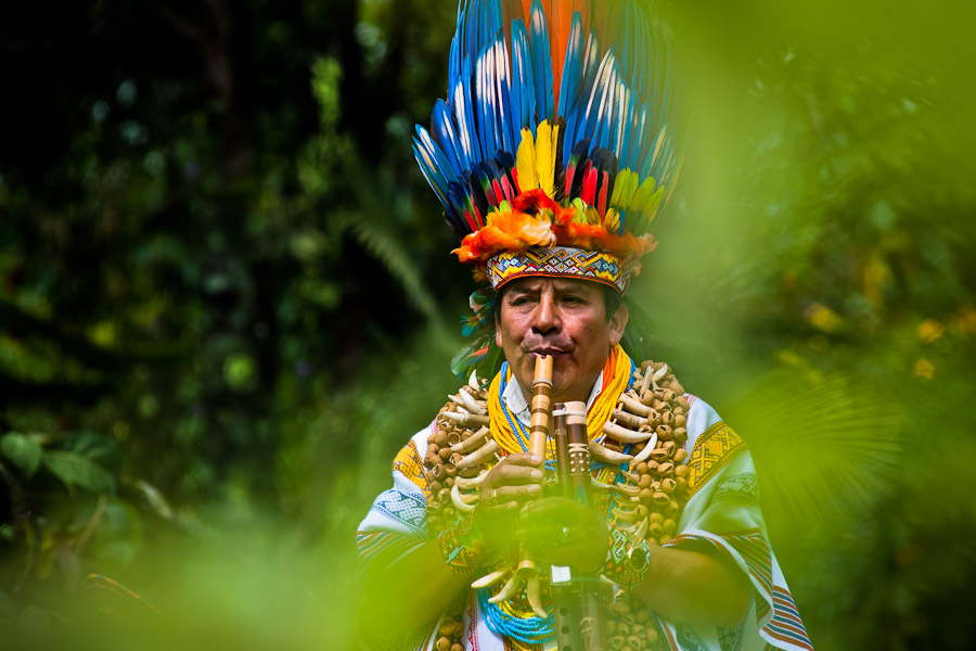 A Kamentsa shaman (taita) plays flute during the traditional indigenous fiesta in Sibundoy, Colombia.