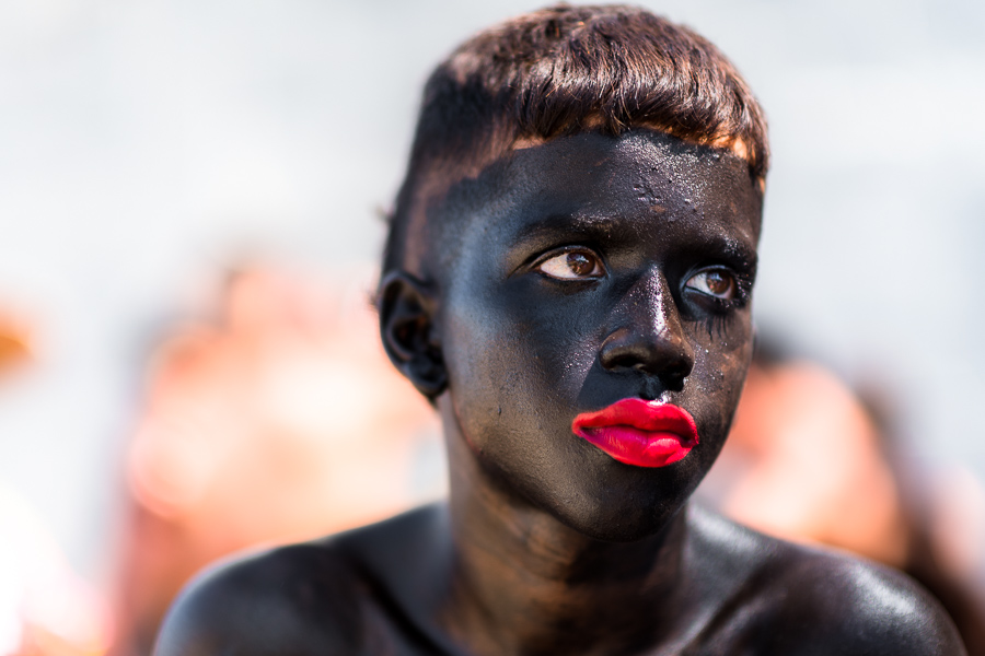 An Afro-Colombian boy, a member of the folkloric group Son de Negro, poses for a picture during the preparations for the parade of the Carnival in Barranquilla, Colombia.