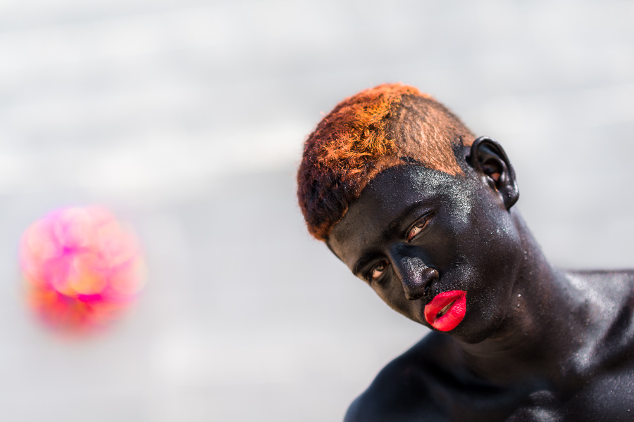 A young Afro-Colombian man, a member of the folkloric group Son de Negro, poses for a picture during the preparations for the parade of the Carnival in Barranquilla, Colombia.