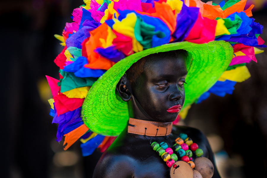 An Afro-Colombian boy, a member of the folkloric group Son de Negro, prepares himself for the parade of the Carnival in Barranquilla, Colombia.