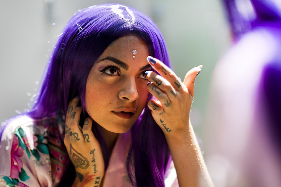 A Colombian webcam model, known as Sthephanie Mwarnert, glues a jewel on her forehead before performing a live show, broadcasted online from her apartment in Medellín, Colombia.