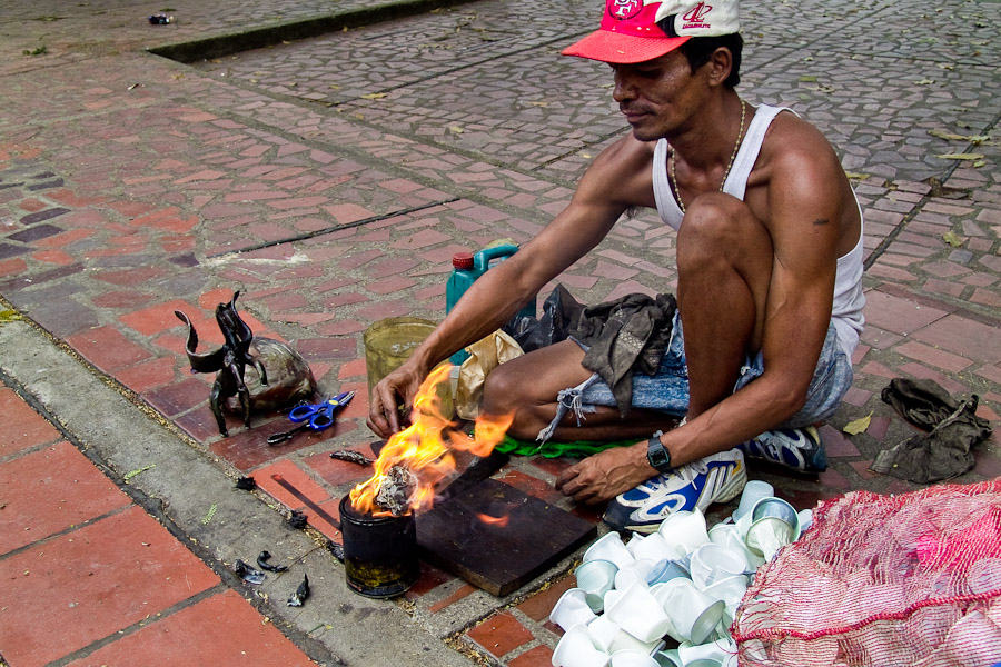 Collecting and recycling of used plastic cups from the city dustbins allows him to create simple shaped plastic statuettes, usually animals.