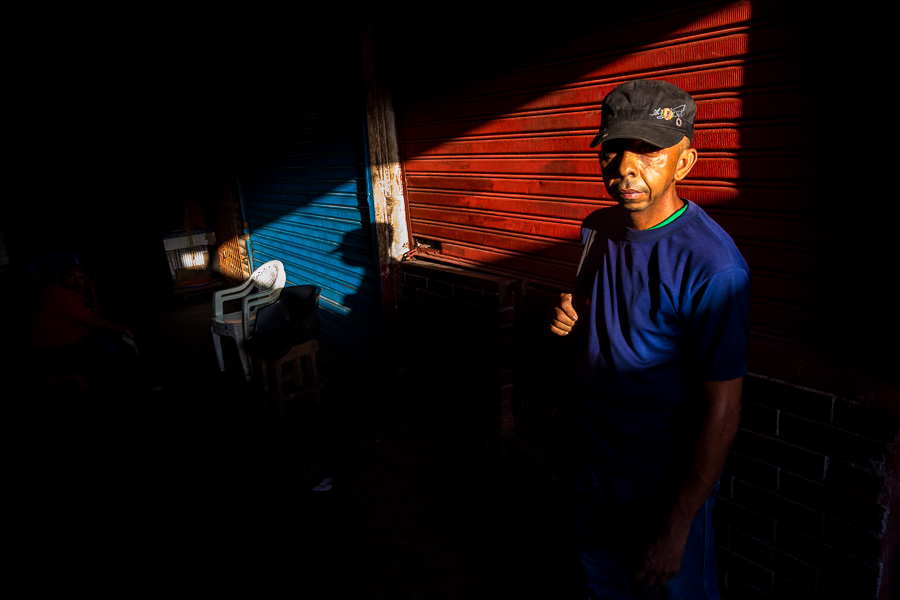 An Afro-Colombian street vendor waits at the market of Bazurto in Cartagena, Colombia.