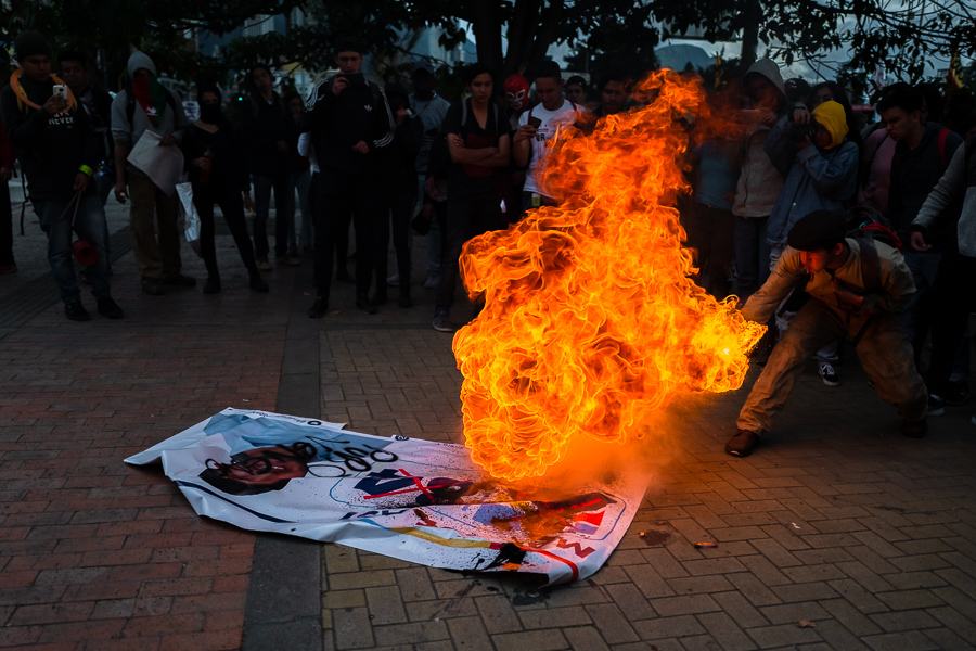 A student of the Universidad Nacional de Colombia spits fire during a protest march against government’s policies and corruption within the public educational system in Bogotá, Colombia.