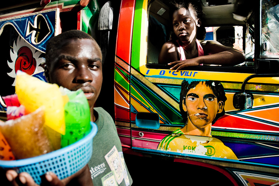 Tap-tap vehicles, decorated with bright and shiny colors, serve as public transportation in Haiti.