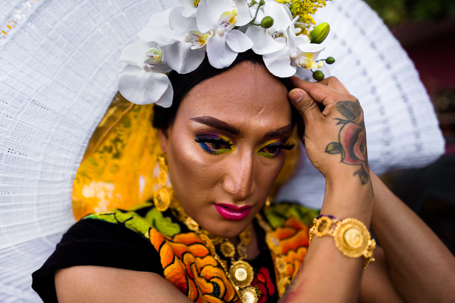 A Mexican “Muxe” (a homosexual man wearing female clothes) adjusts her floral headband during the traditional “Muxe” celebration in Juchitán, Oaxaca, Mexico.