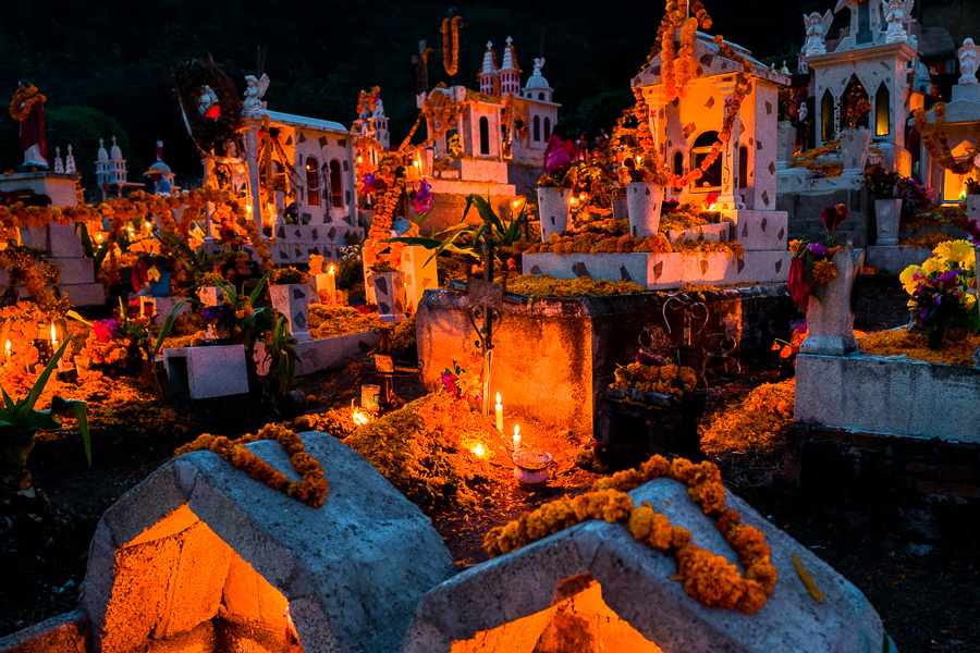 Tombs and graves, decorated with marigold flowers, are seen illuminated by burning candles during the Day of the Dead celebration at the cemetery in Xalpatláhuac, Guerrero, Mexico.
