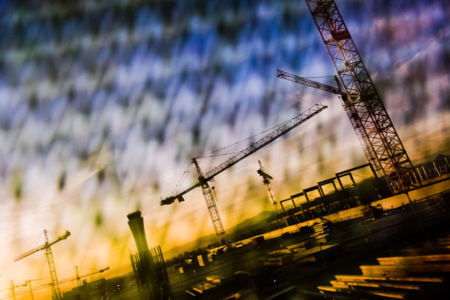 A tower crane on a construction site during sunset, Malaga, Spain.