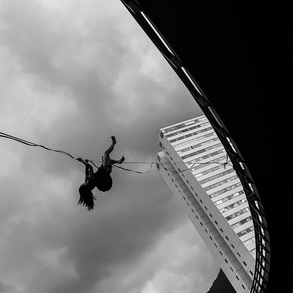 A Colombian girl falls off a slackline after losing balance during activities carried out as part of a political protest organized by a feminist group in Bogotá, Colombia.