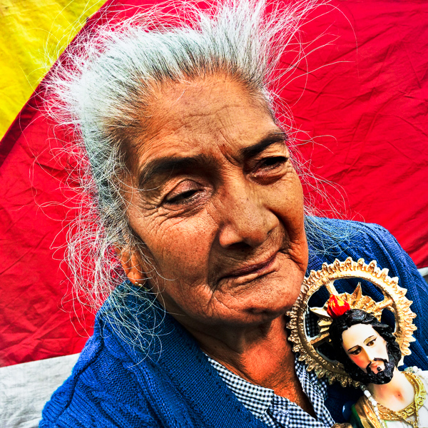 A Mexican woman, holding a religious statue, takes a part in a catholic procession of Judas Thaddaeus (San Judas Tadeo) in Mexico City, Mexico.