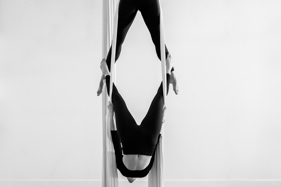Colombian aerial dancers perform a duo act on aerial silks during a training session in a gym in Medellín, Colombia.