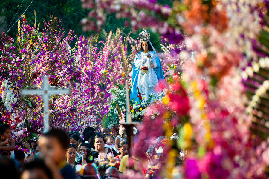 An altar with a statue of Virgin Mary is carried during the procession of the Flower & Palm Festival in Panchimalco, El Salvador.