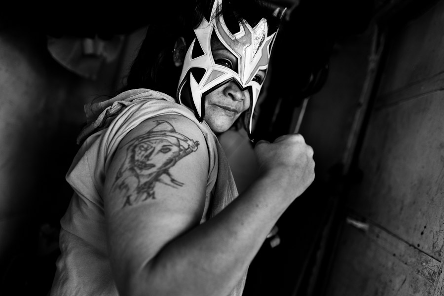 A Mexican female wrestler before a wrestling match held on the street arena in Mexico City, Mexico.