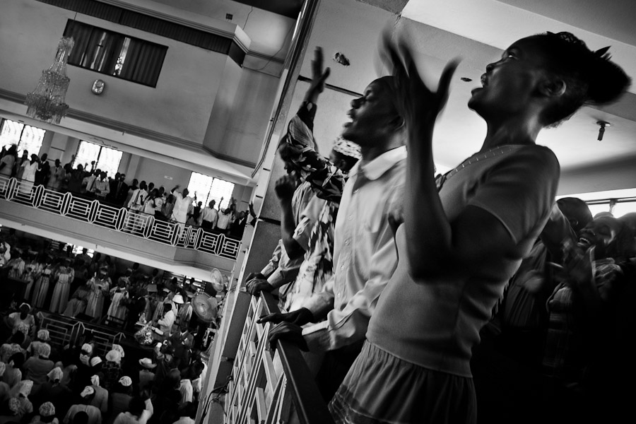 Catholic followers sing prayers during the Sunday mass in Delmas, Port-au-Prince, Haiti.