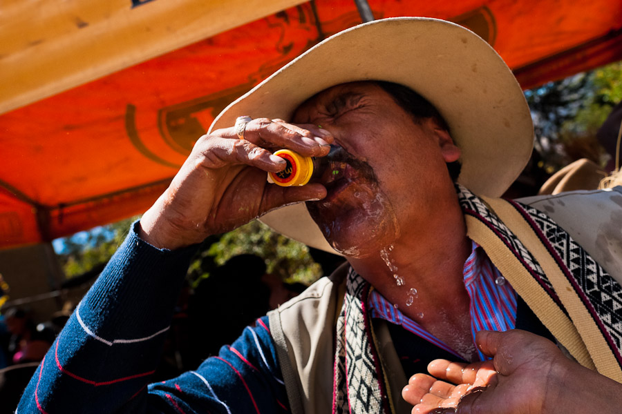 A Peruvian peasant drinks liquor during the Yawar Fiesta, a ritual fight between the condor and the bull, held in the mountains of Apurímac, Peru.